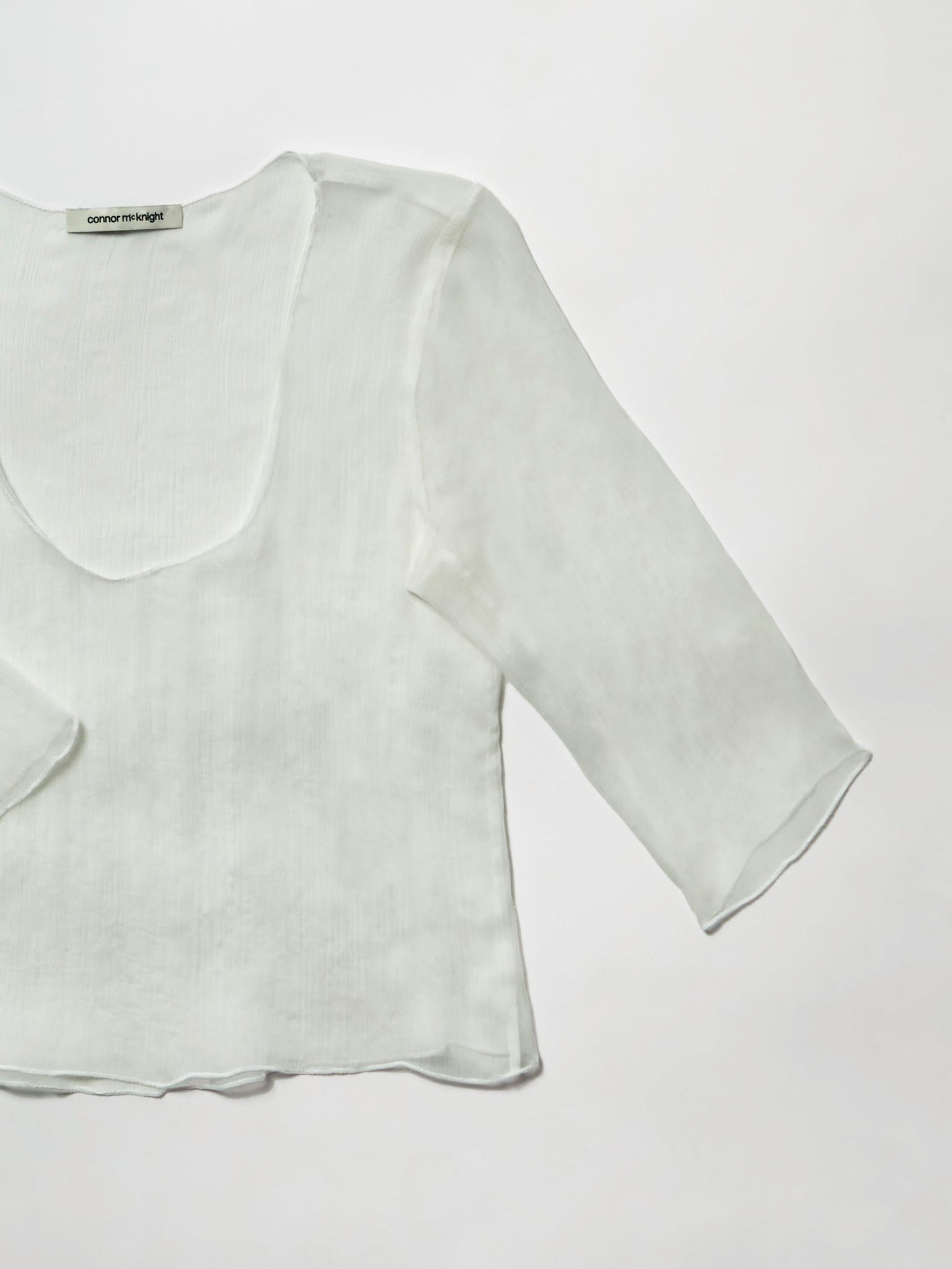 feather half sleeve top - white